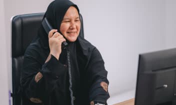 Staff member ready to assist with work permit renewal